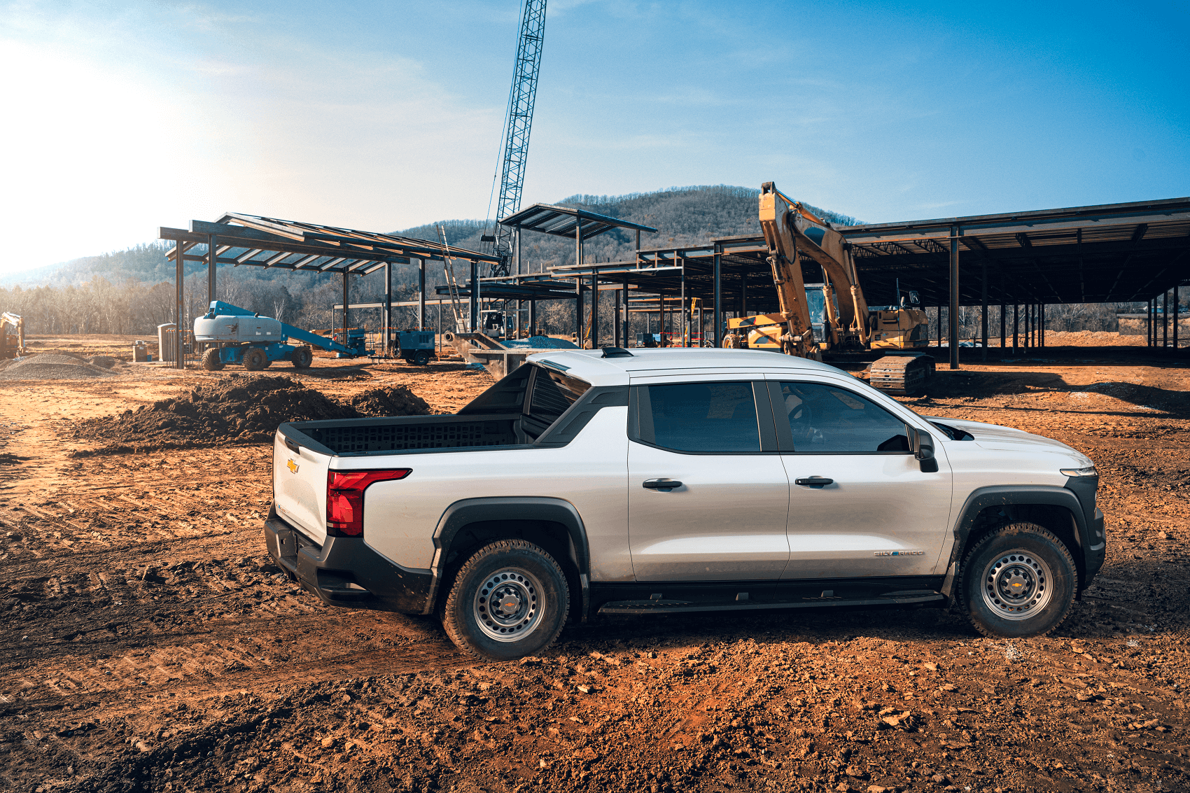 white chevy colorado parked on a construction site